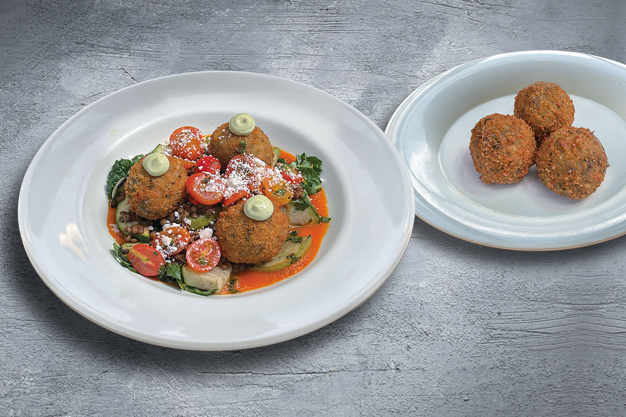 Our Patato-Mushroom Croquetas dish and plate with 3 croquetas on a surface