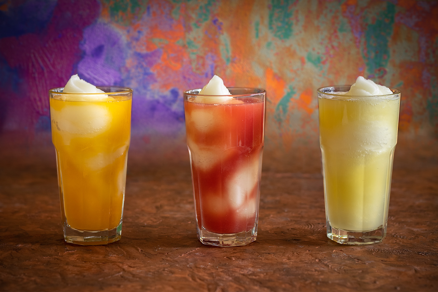 Three of our new Agua Fresca Swirls drinks with a colorful table setting